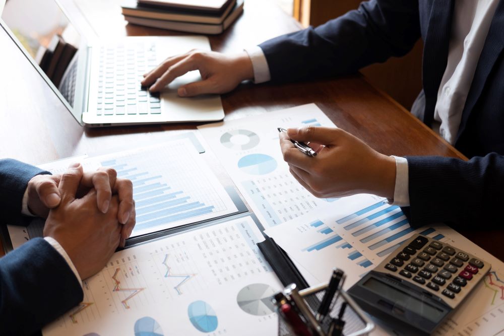 Two men reviewing displayed data 