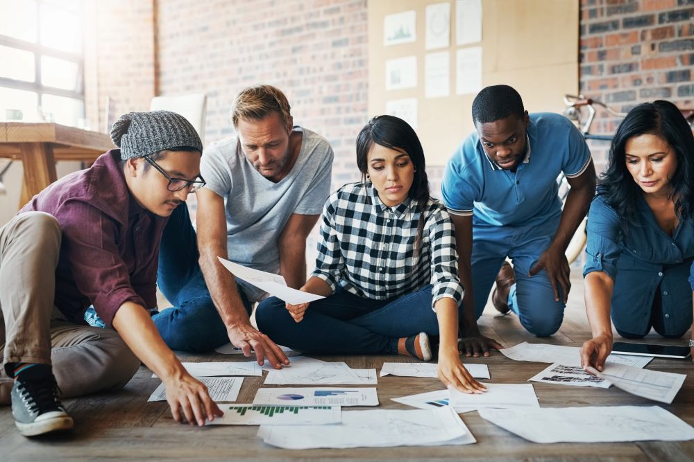 Diverse group of people reviewing documents in the office